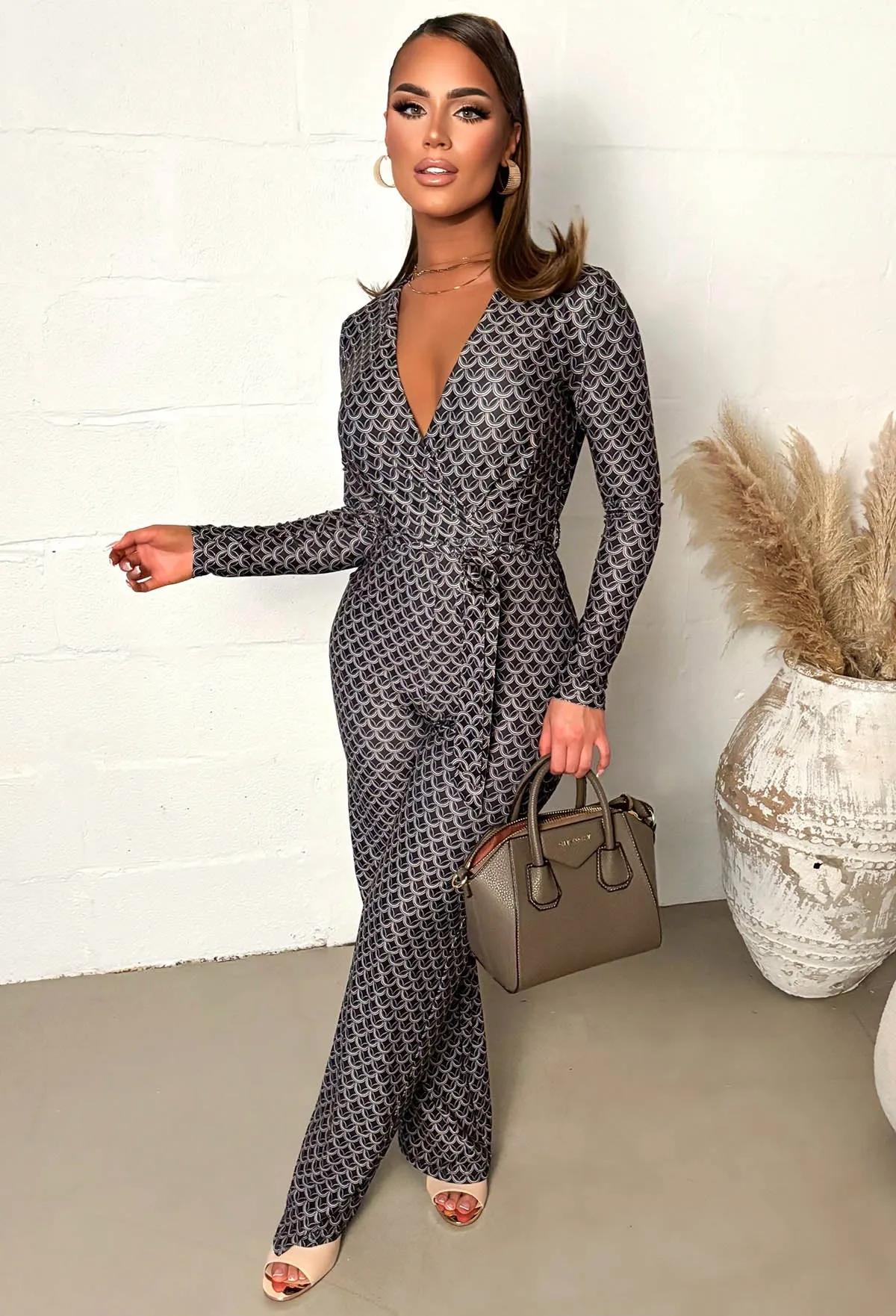 Catwalk Vibes Black Wrap Front Geo Print Jumpsuit