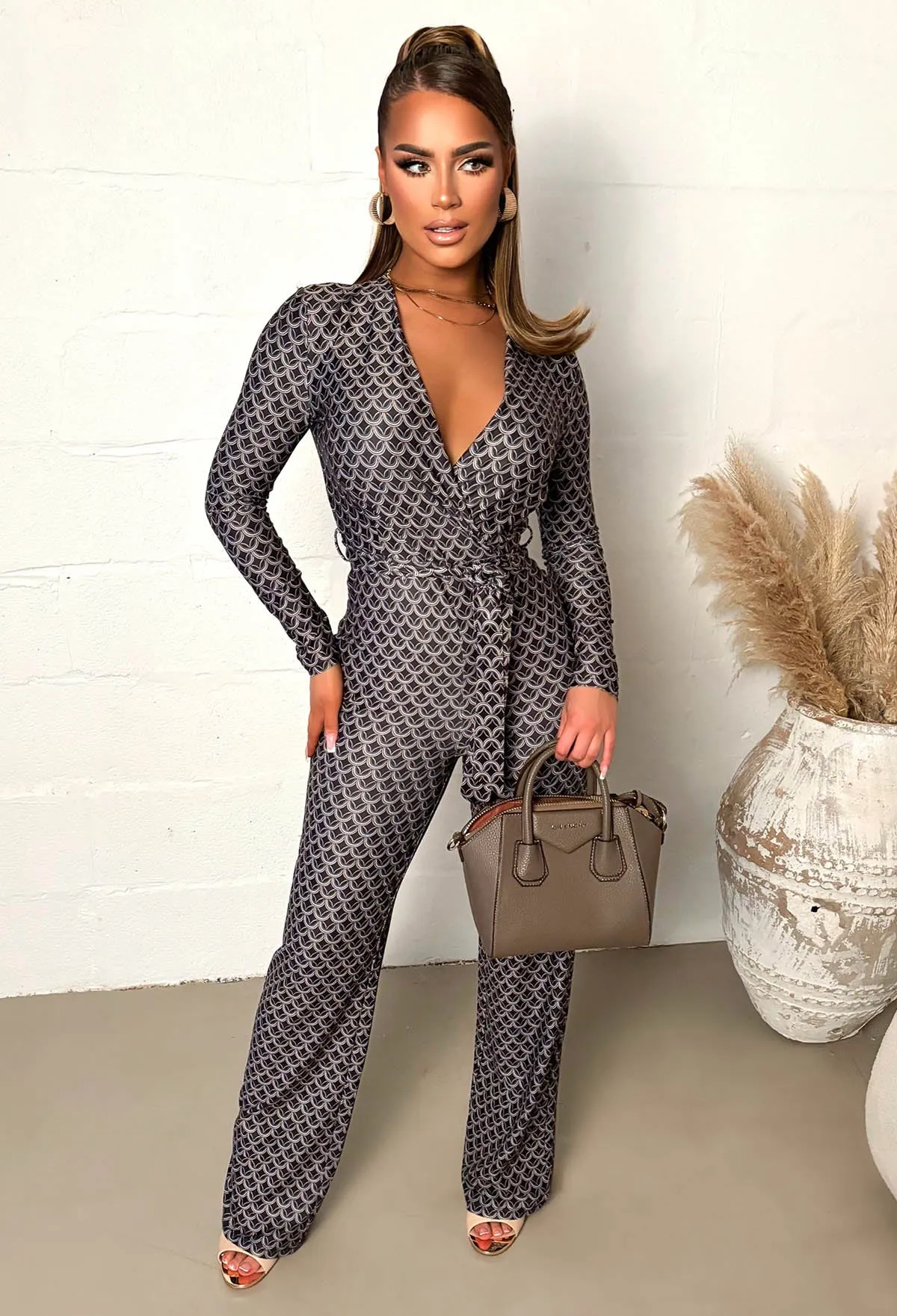 Catwalk Vibes Black Wrap Front Geo Print Jumpsuit