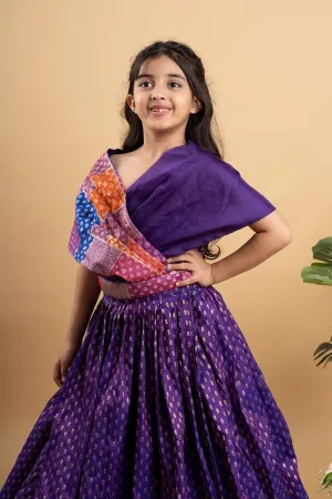 Elegant purple silk lehenga choli with vibrant patchwork detailing, perfect for festive celebrations